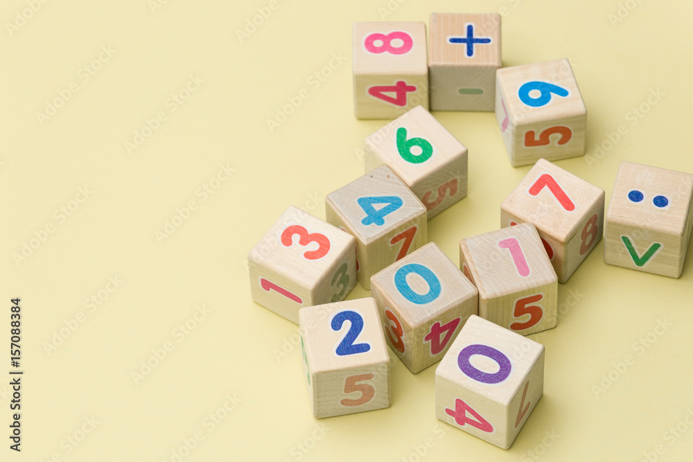 Wooden cubes with numbers on light green background Wooden cubes with numbers on light green background