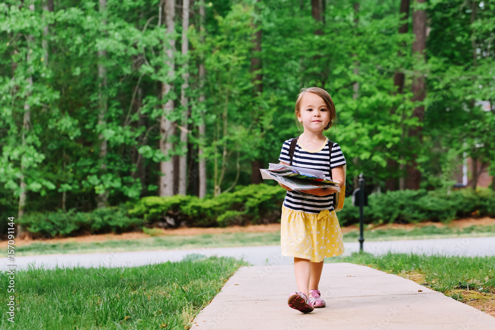 Happy Toddler girl arriving home from school Happy Toddler girl arriving home from school