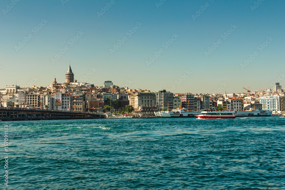 View of  Galata Tower, Galata Bridge  in Karakoy quarter of Istanbul. Ferries float on Golden Horn waterway.Bosphorus.Turkey.