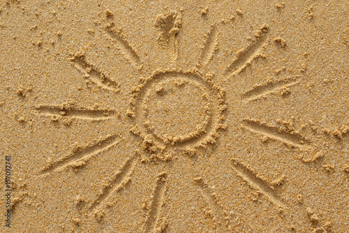 Drawing of sun on the sand