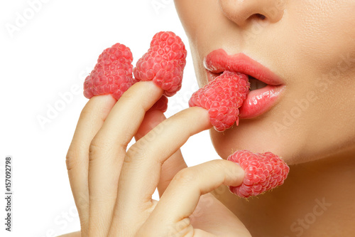 Female lips and raspberries