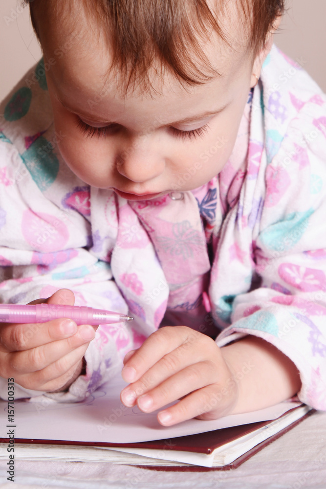 little baby girl learns to write (development, education) little baby girl learns to write (development, education)