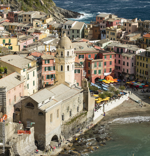 colored houses and church in city on the sea in Italy