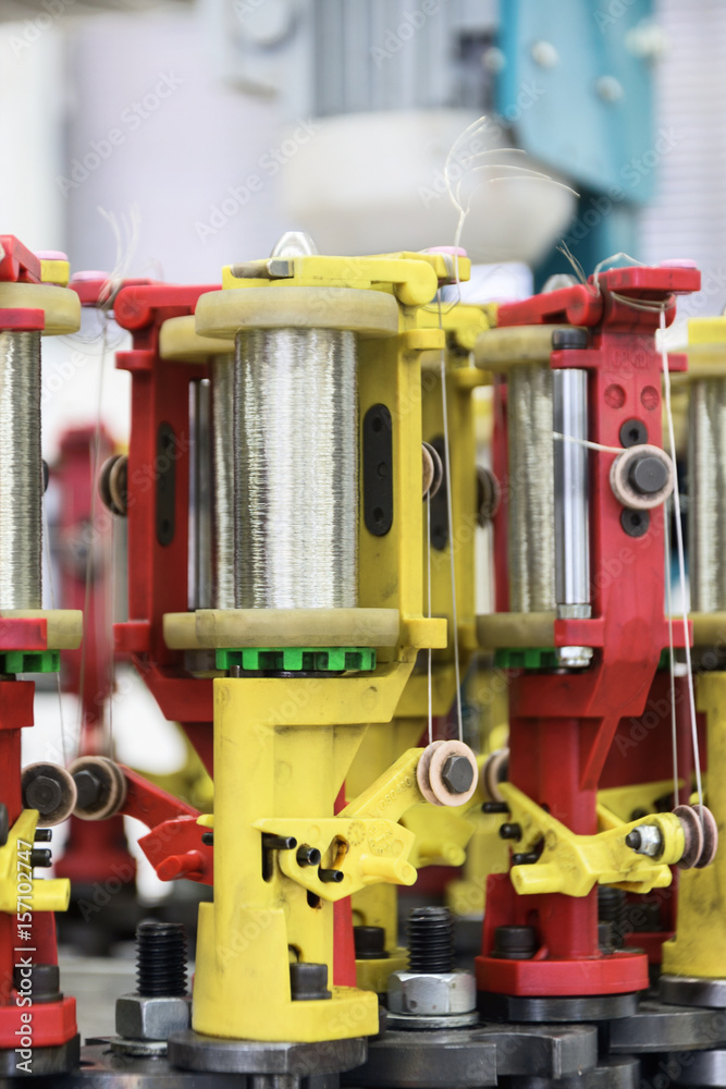 Modern braiding machine. Modern braiding machine.