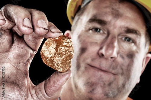 Фотография Gold miner with nugget
