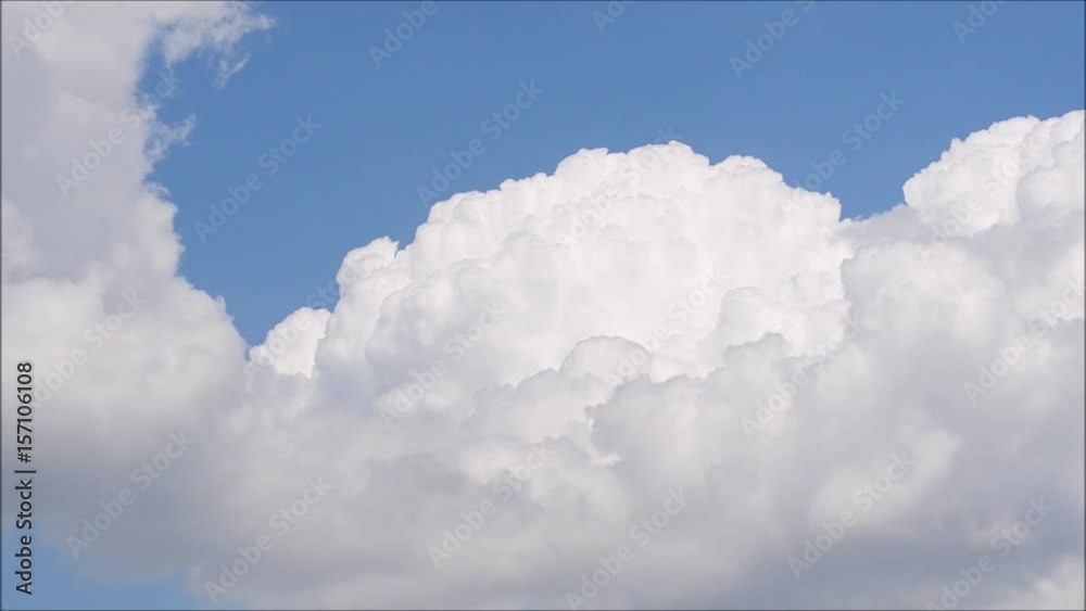 White clouds move across clear blue sky. Cloudy blue sky background. White clouds move across clear blue sky. Cloudy blue sky background.