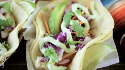 Street fish tacos with cod in recycled paper food tray photo