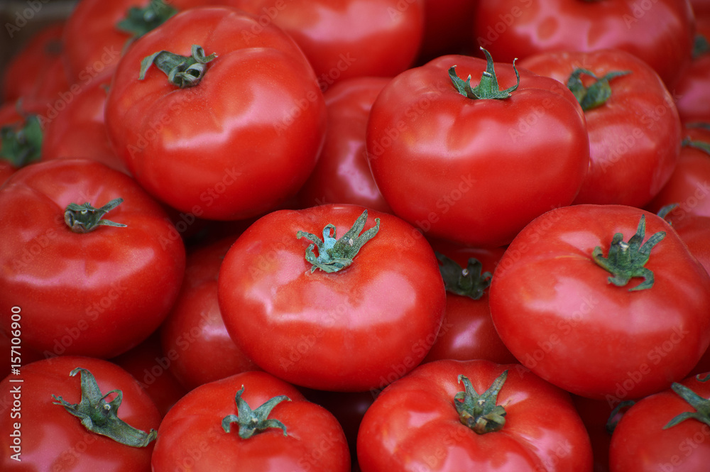 Heap of large size tomatoes on the counter Heap of large size tomatoes on the counter