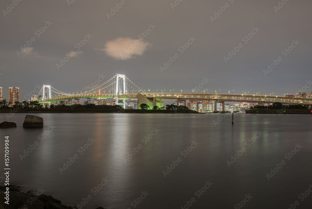 View rainbow bridge odaiba tokyo japan at night .