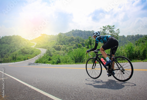 women cycling mountain road bike in the morning