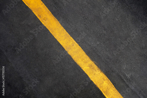 Yellow line on road texture background © tang90246