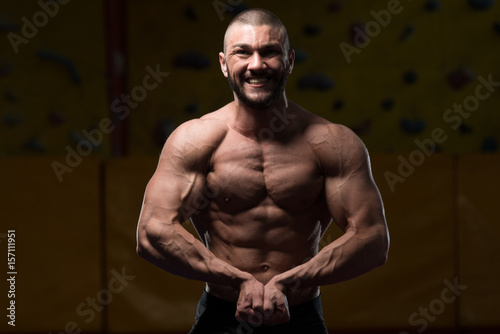 Muscular Body Builder Showing His Front Abdominal Abs