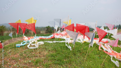 Colorful flags on chinese grave