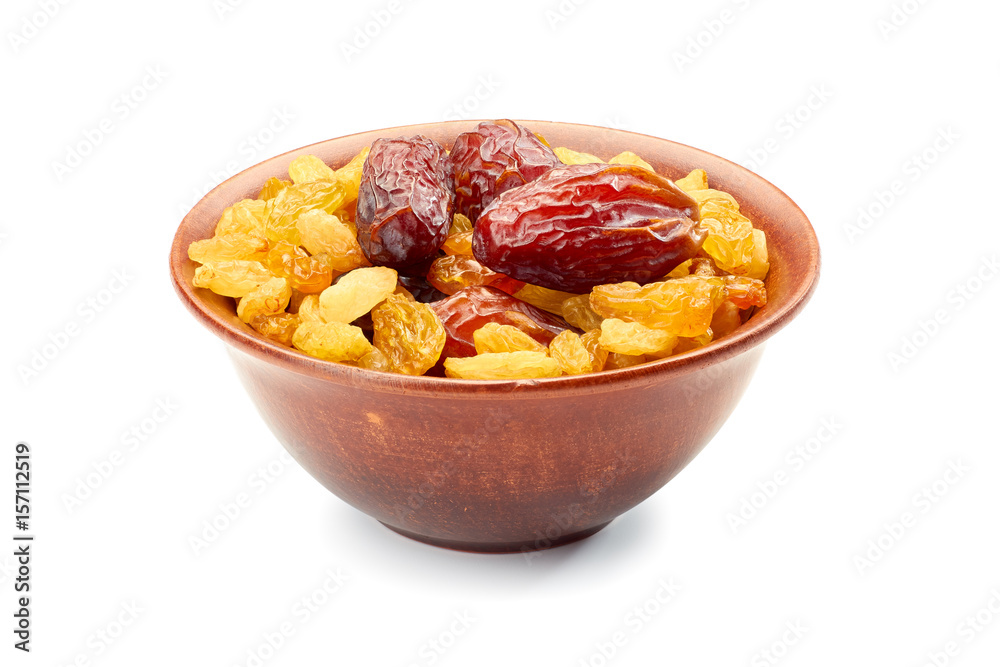 Bowl of raisins and date fruits on white Bowl of raisins and date fruits on white