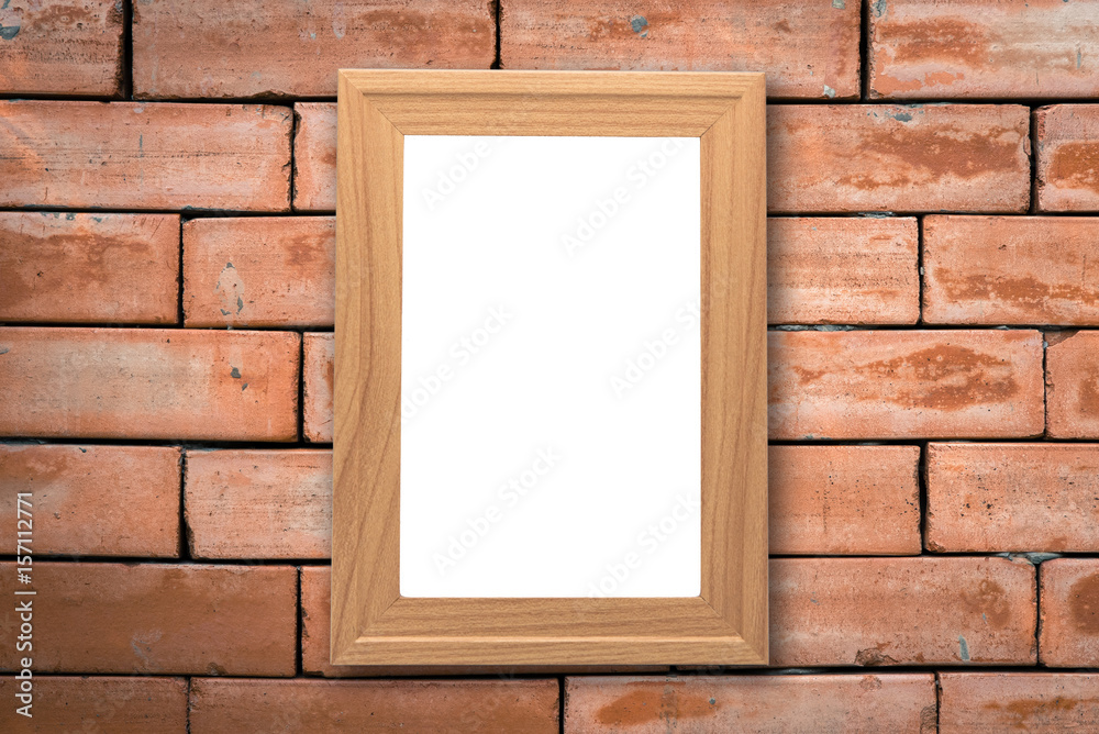Mock up blank poster picture wooden frame on old brick wall in vintage tone with grass front ground. Mock up blank poster picture wooden frame on old brick wall in vintage tone with grass front ground.