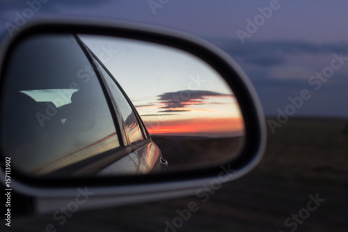 Dirt Road and Sunset In Mirror
