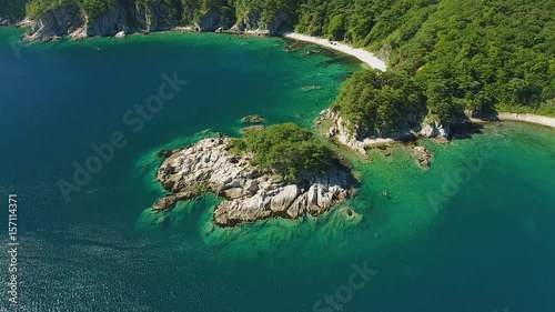 Famous tourist sightseeing Island of Languishing Heart. Far East Marine Biosphere Reserve Primorsky Krai Vladivostok Russia. Unique National park Japan Sea oean. Aerial Helicopter Drone flight. 4k photo