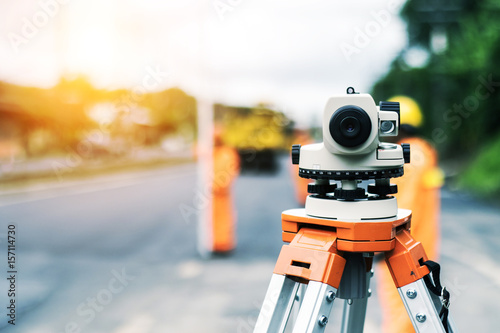 Surveyor’s telescope at new road construction site