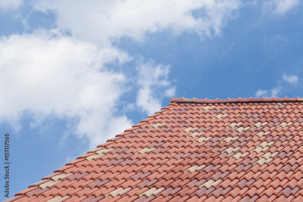 Brown roof tiles with blue sky background
