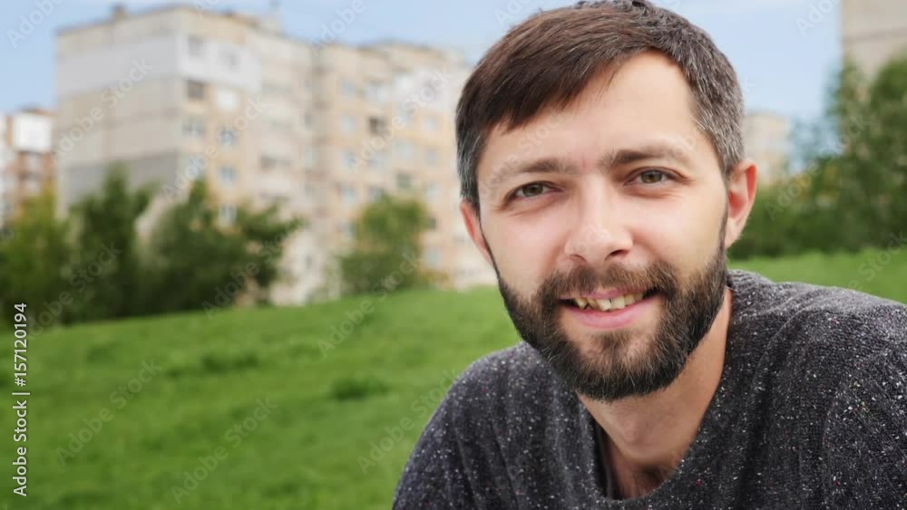 Close up portrait happy young man looking at camera Close up portrait happy young man looking at camera