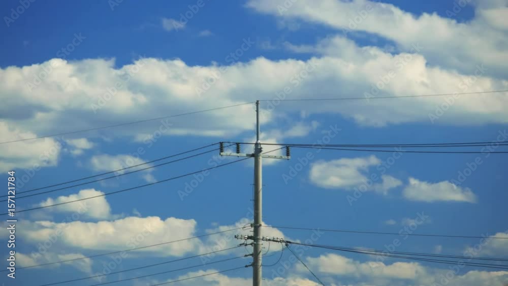 Telegraph pole with clouds moving in timelapse scene Telegraph pole with clouds moving in timelapse scene