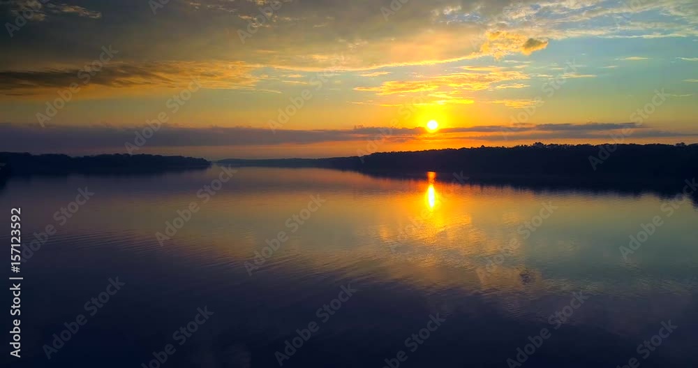 Colorful, moving sunrise in dramatic sky, low aerial view.
Colorful, moving sunrise in dramatic sky, low aerial view.