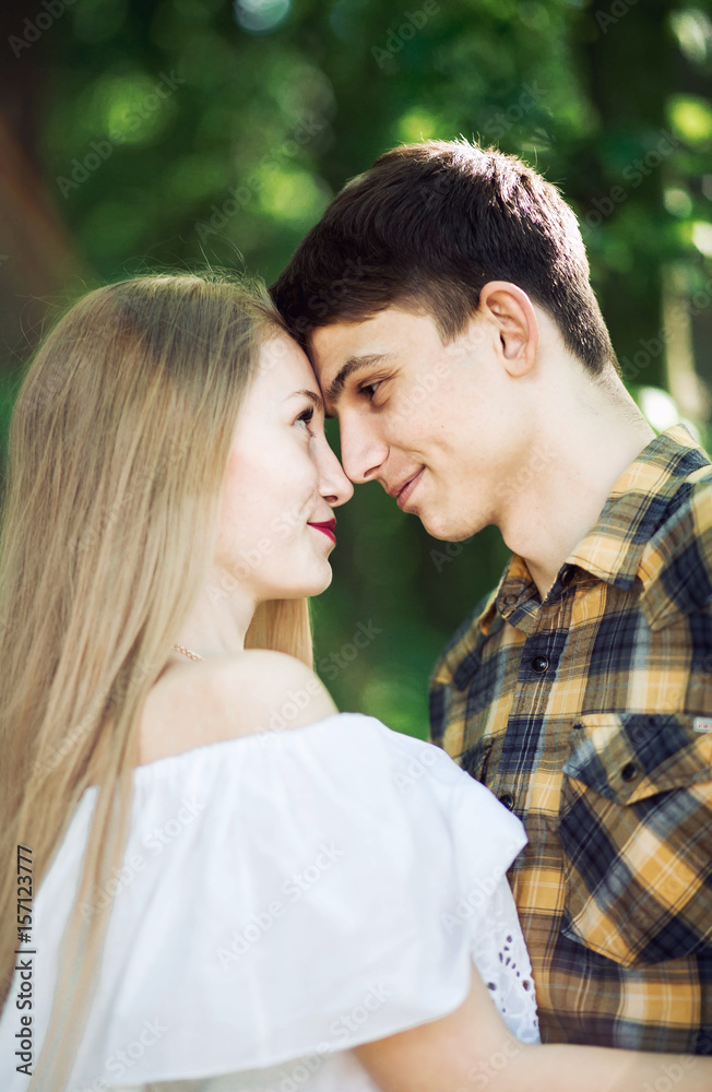 Obraz premium Romantic young couple look at each other. Moment before a kiss