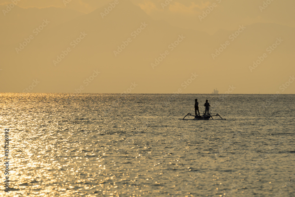 Traditional fisherman during majestic sunset in Lombok, Indonesia