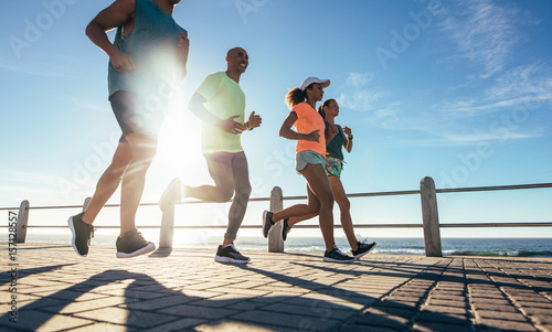 Young runners workout on the sea front path