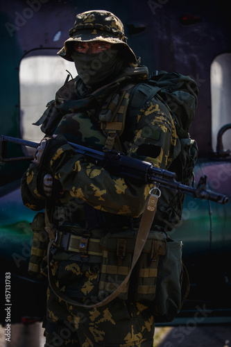 Photo of a soldier with an automatic rifle © snedorez