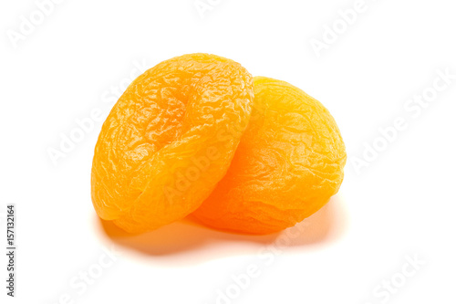 Two dried apricots on white