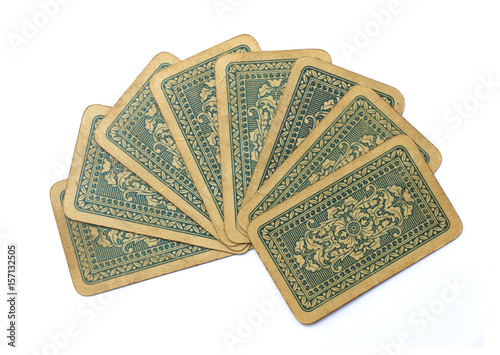 Photo of old antique playing cards fan isolated on white background