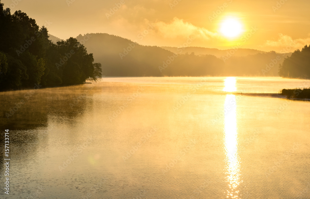 Fototapeta premium Misty sunset on the lake