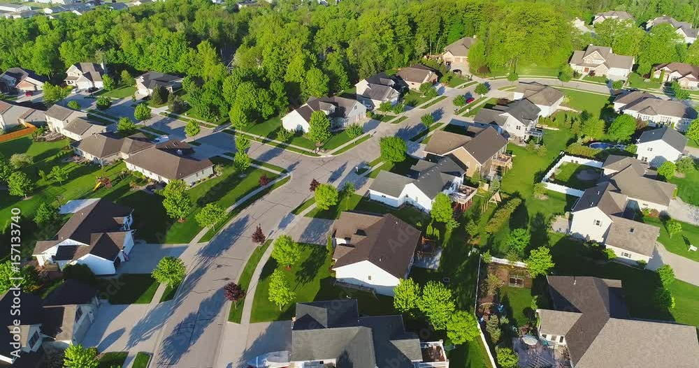 Exceptionally beautiful suburban neighborhoods, homes, aerial view at sunrise.
