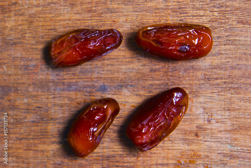 The dates fruits on wooden table with dramatic light