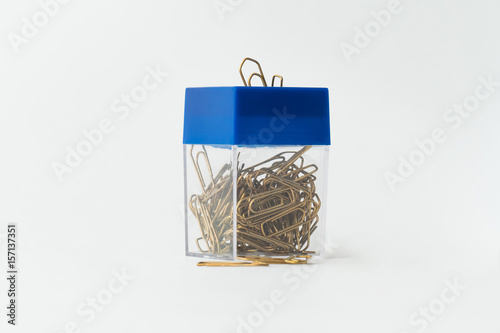 Box of office staples / Box with office clips isolated on white
