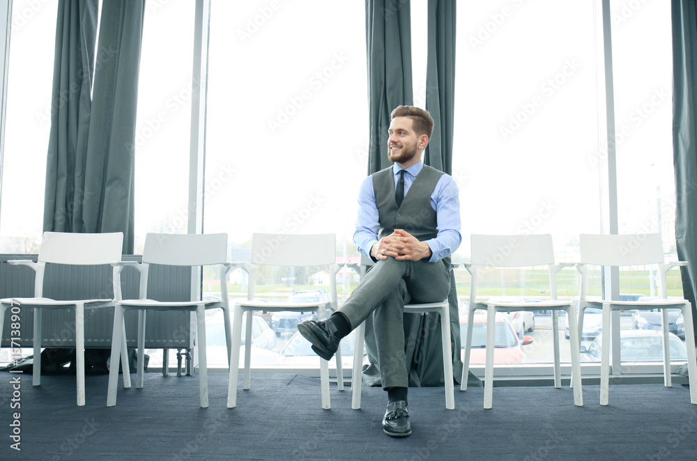 Fototapeta premium Young man waiting for job interview indoors.