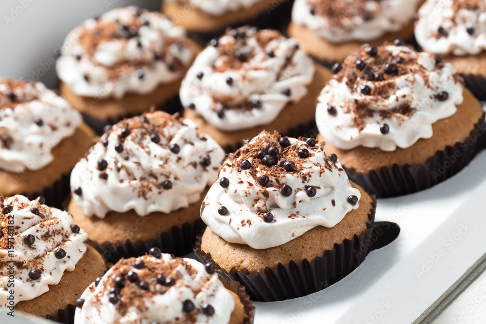 Coffee cupcakes with mocha buttercream and chocolate decorations Coffee cupcakes with mocha buttercream and chocolate decorations