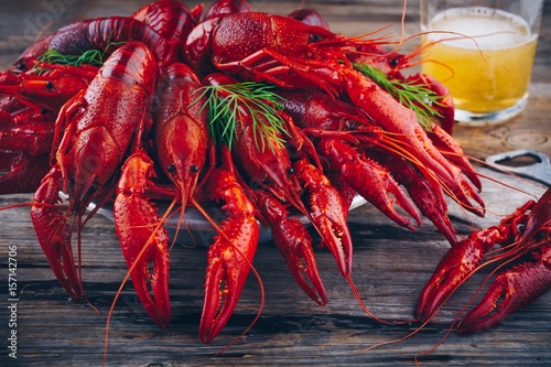 Boiled crayfish with dill and beer photo