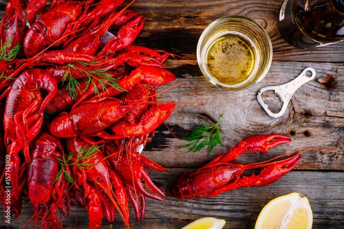 Boiled crayfish with dill and beer photo