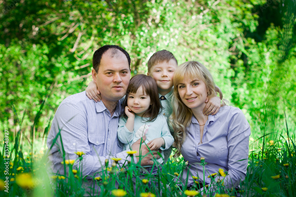 Fototapeta premium Family portrait in a spring park.