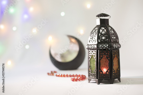 Lantern and Rosary with crescent in a background