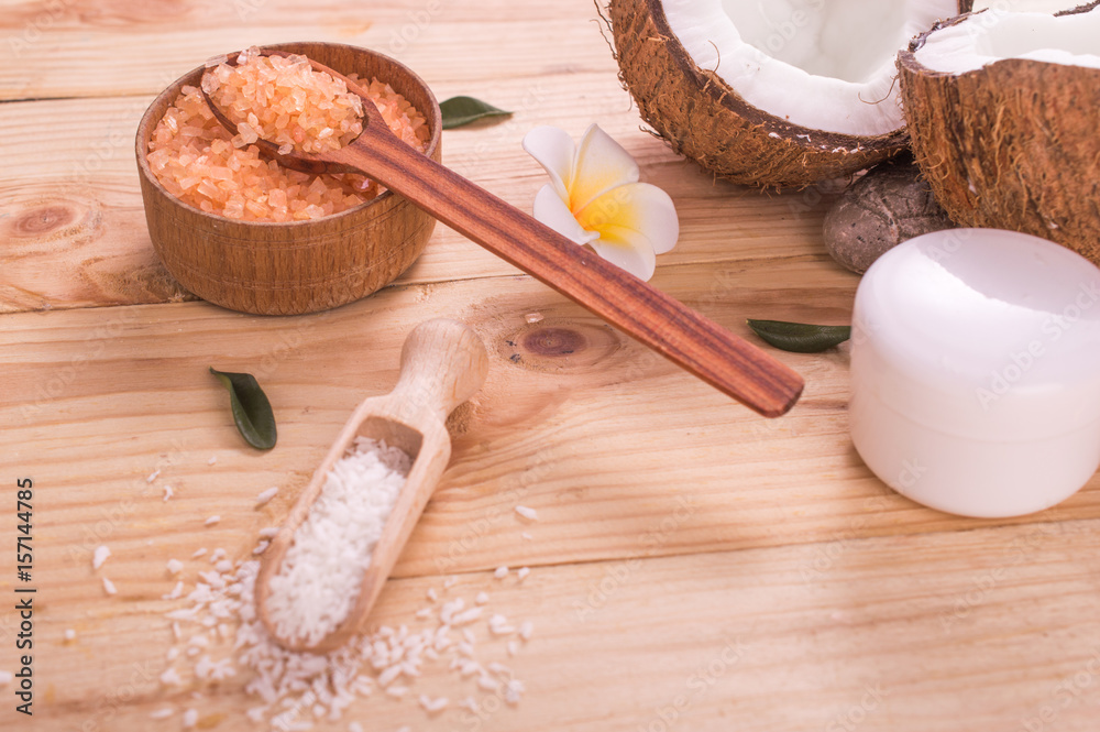 Coconut and oil on wooden table .Organic and healthy food concept. Beauty and SPA treatment product. Coconut and oil on wooden table .Organic and healthy food concept. Beauty and SPA treatment product.