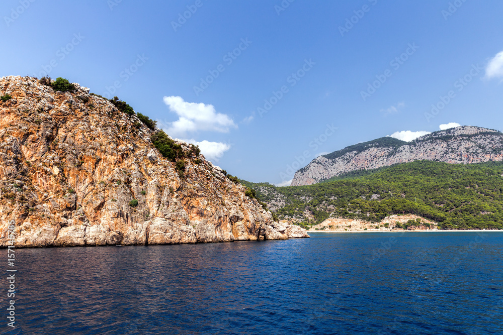 Island, rock and Mediterranean sea