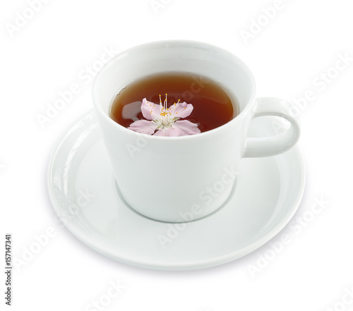 Tea in a cup with cherry flower