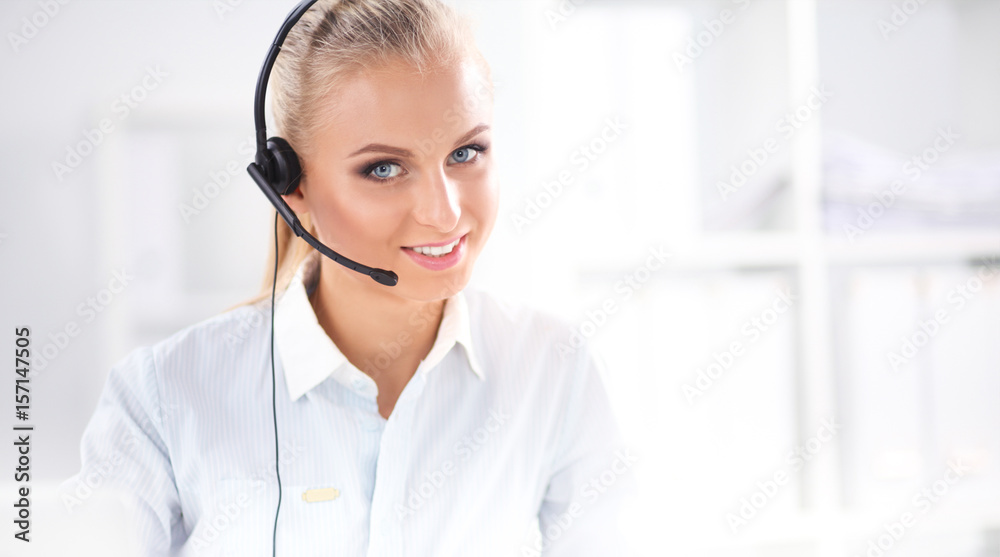 Portrait of beautiful businesswoman working at her desk with he Portrait of beautiful businesswoman working at her desk with he