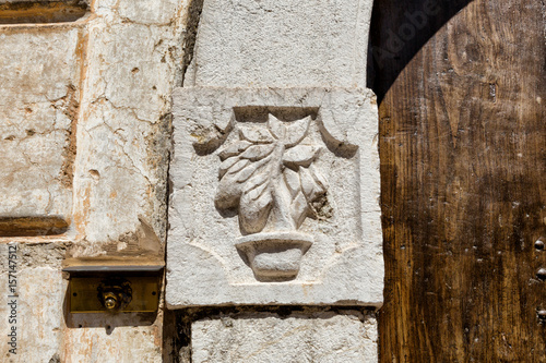 Solopaca (Benevento, Italy) - A decoration on a door in the old city centre photo