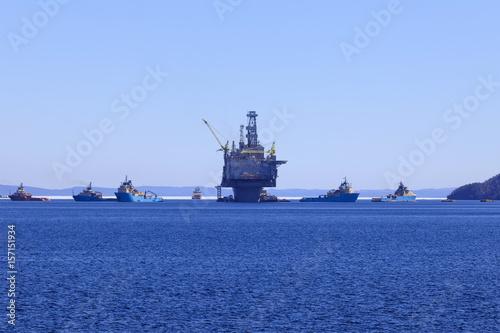 Oil and gas rig with supply ships