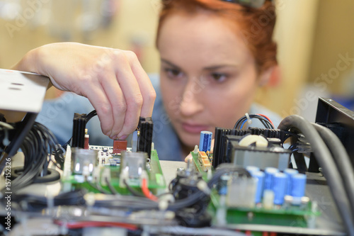 Woman working on electrical system