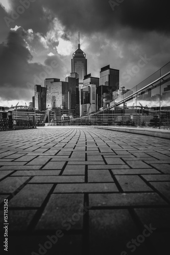 Abstract futuristic night cityscape with illuminated skyscrapers.Hong Kong black and white background